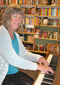 Lourey signing books