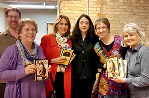Helen MacDonald and company, holding her books.