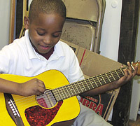 Young guitarist playing