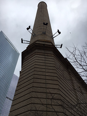 Chimney against stormy clouds