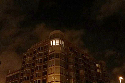 One lighted apartment in the night