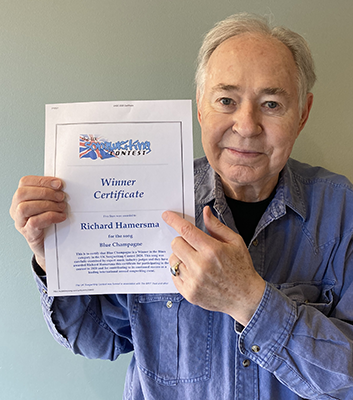Richard Hamersma holding certificate of award
